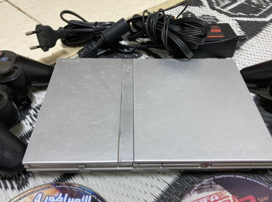 PS2 with 3cds,cables and 2 controllers for sale