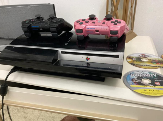 PS3 with 2 controllers, 2 games for sale