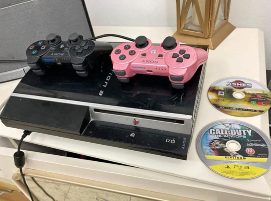 PS3 with 2 controllers, 2 games for sale