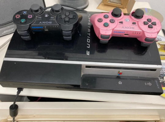 PS3 with 2 controllers, 2 games for sale