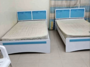 2 single bed with mattress and one said tabal for