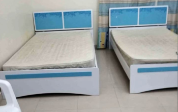 2 single bed with mattress and one said tabal for