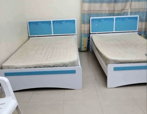 2 single bed with mattress and one said tabal for