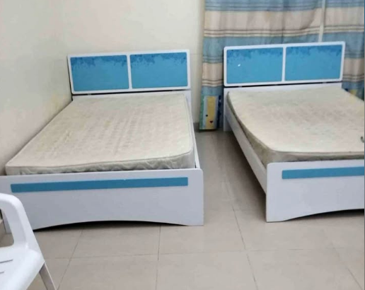 2 single bed with mattress and one said tabal for