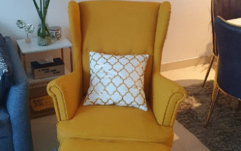Ikea yellow armchair with the stool for sale